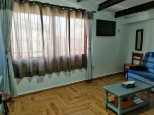 a living room with a couch and a table at ATICO Loli in Berga