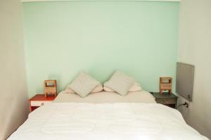 Cama ou camas em um quarto em Eco-Hostal Tambo Verde