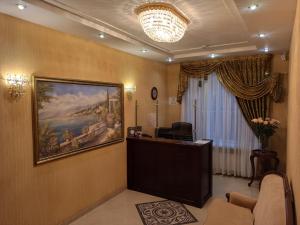 a waiting room with a painting on the wall at Hotel Status in Vinnytsya