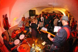 a group of people standing in a room with drums at Auberge de Jeunesse HI Serre-Chevalier in La Salle Les Alpes