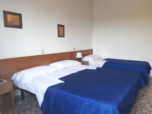 Posteľ alebo postele v izbe v ubytovaní B&B Garnì Da Vito