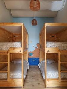 Cama ou camas em um quarto em Eco-Hostal Tambo Verde