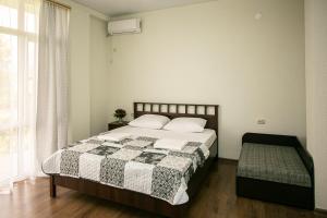 Un pat sau paturi într-o cameră la SanZazila
