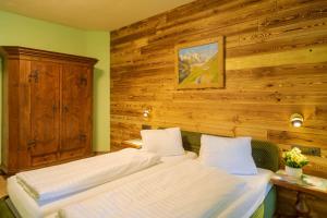 Voodi või voodid majutusasutuse Putzenhof Appartements toas