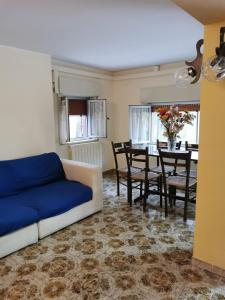 a living room with a couch and a table at Borgo San Biagio in Basicò