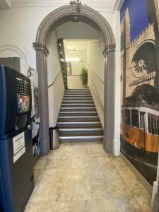 an archway leading up to a staircase in a building at Estrela de Arganil - Luis Simões & Conceição, Lda in Lisbon