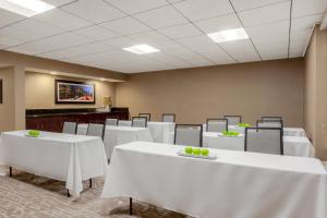 a conference room with white tables and chairs at Holiday Inn La Mirada Buena Park by IHG in La Mirada
