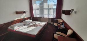 Letto o letti in una camera di Hotel Jerabek