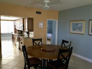 a dining room and kitchen with a table and chairs at Island House Beach Resort 16N in Siesta Key