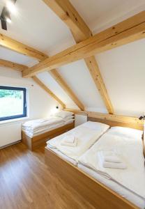 Postel nebo postele na pokoji v ubytování Apartmany Slunecnice