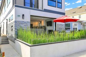 a red umbrella in front of a house at 308 35th Street, Unit A (Lower) in Newport Beach +21 photos