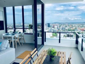 a living room with a view of a city at AirTrip Apartments on Merivale Street in Brisbane