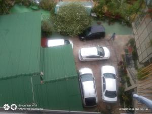 a group of cars parked in a parking lot at Lucky Star Ella in Ella