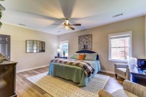 a bedroom with a bed and a ceiling fan at Upcountry Inn in Helen