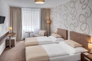 Letto o letti in una camera di Hotel Atlas