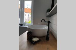 Kúpeľňa v ubytovaní Apartament w kamienicy Przy Plantach