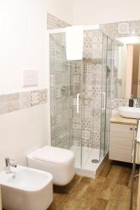 a bathroom with a shower and a toilet and a sink at B&B Vivere San Vito Lo Capo in San Vito lo Capo