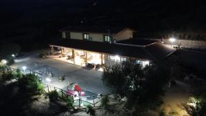 an aerial view of a house at night at Agriturismo La Vallata in Masseria Scilva +27 photos