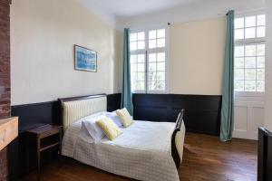 Postel nebo postele na pokoji v ubytování Villa Des Dunes