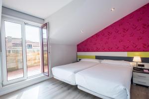 Postel nebo postele na pokoji v ubytování Apartamentos La Albarca