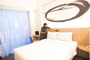 Giường trong phòng chung tại Enso Hotel