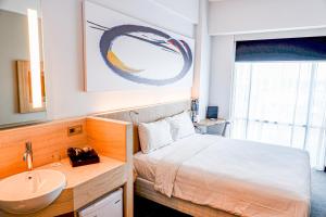 Giường trong phòng chung tại Enso Hotel