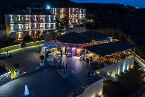 an aerial view of a hotel at night at Petani Bay Hotel - Adults Only in Vóvikes