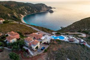 an aerial view of a house next to a beach at Petani Bay Hotel - Adults Only in Vóvikes