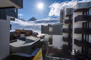 a view of a snow covered mountain from a building at Studio 4 personnes au pied des pistes in Tignes