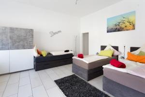 Postel nebo postele na pokoji v ubytování Oberkasseler Hof Bonn
