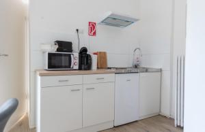 Kuchyň nebo kuchyňský kout v ubytování Oberkasseler Hof Bonn