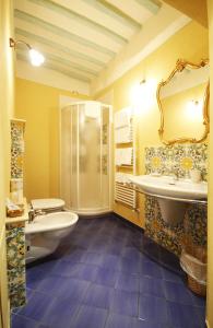 a bathroom with a shower and a toilet and a sink at Antica Residenza Cicogna in Siena