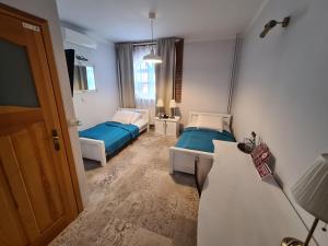 Posteľ alebo postele v izbe v ubytovaní Hotel Staropolska