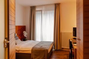 Postel nebo postele na pokoji v ubytování Hotel Begardenhof