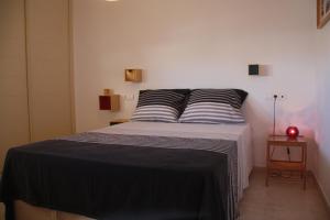 Ένα ή περισσότερα κρεβάτια σε δωμάτιο στο Holiday apartment Amatista