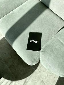 a black and white sign on a white surface at STAY Bryggen in Copenhagen