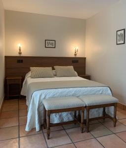 Cama o camas de una habitación en Hotel Villa de Cabrales