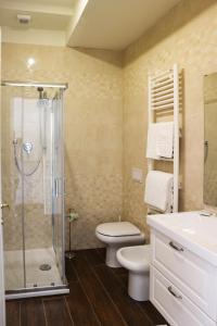 a bathroom with a shower and a toilet and a sink at b&b Da Morena in Termoli