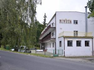 a white building on the side of a street at ReVita in Szklarska Poręba