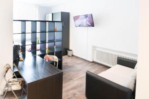 TV a/nebo společenská místnost v ubytování Central Apartments Aalen