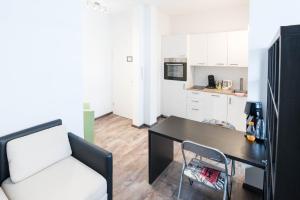Kuchyň nebo kuchyňský kout v ubytování Central Apartments Aalen