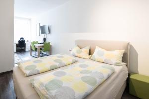Postel nebo postele na pokoji v ubytování Central Apartments Aalen
