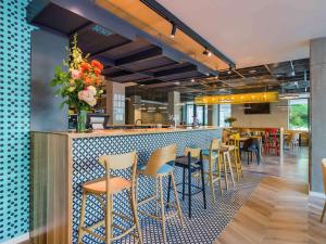 Un restaurant sau alt loc unde se poate mânca la ibis Styles Bucharest City Center