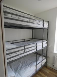 a closet with four bunk beds in a room at Donegal Wild Atlantic Hostel in Dungloe