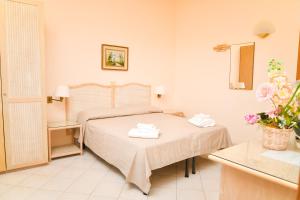 Кровать или кровати в номере Hotel Maremonti