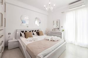 Postel nebo postele na pokoji v ubytování Panos Villa Sunset View