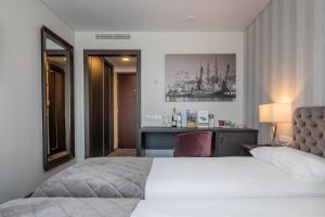 Postel nebo postele na pokoji v ubytování Amberton Hotel Klaipeda