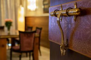 a wooden door with a handle in a room at Palais Medina Riad Resort in Fès