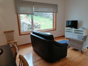 TV a/nebo společenská místnost v ubytování Casa do Murungal