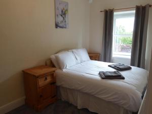 Ένα ή περισσότερα κρεβάτια σε δωμάτιο στο Gwynedd House Flat 3